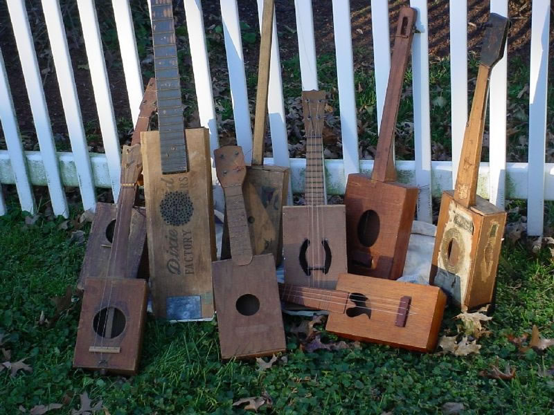 A collection of antique cigar box guitars, banjos and ukuleles. From the National Cigar Box Guitar Museum. Photo by Shane Speal.