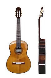 A modern classical guitar from the front and side